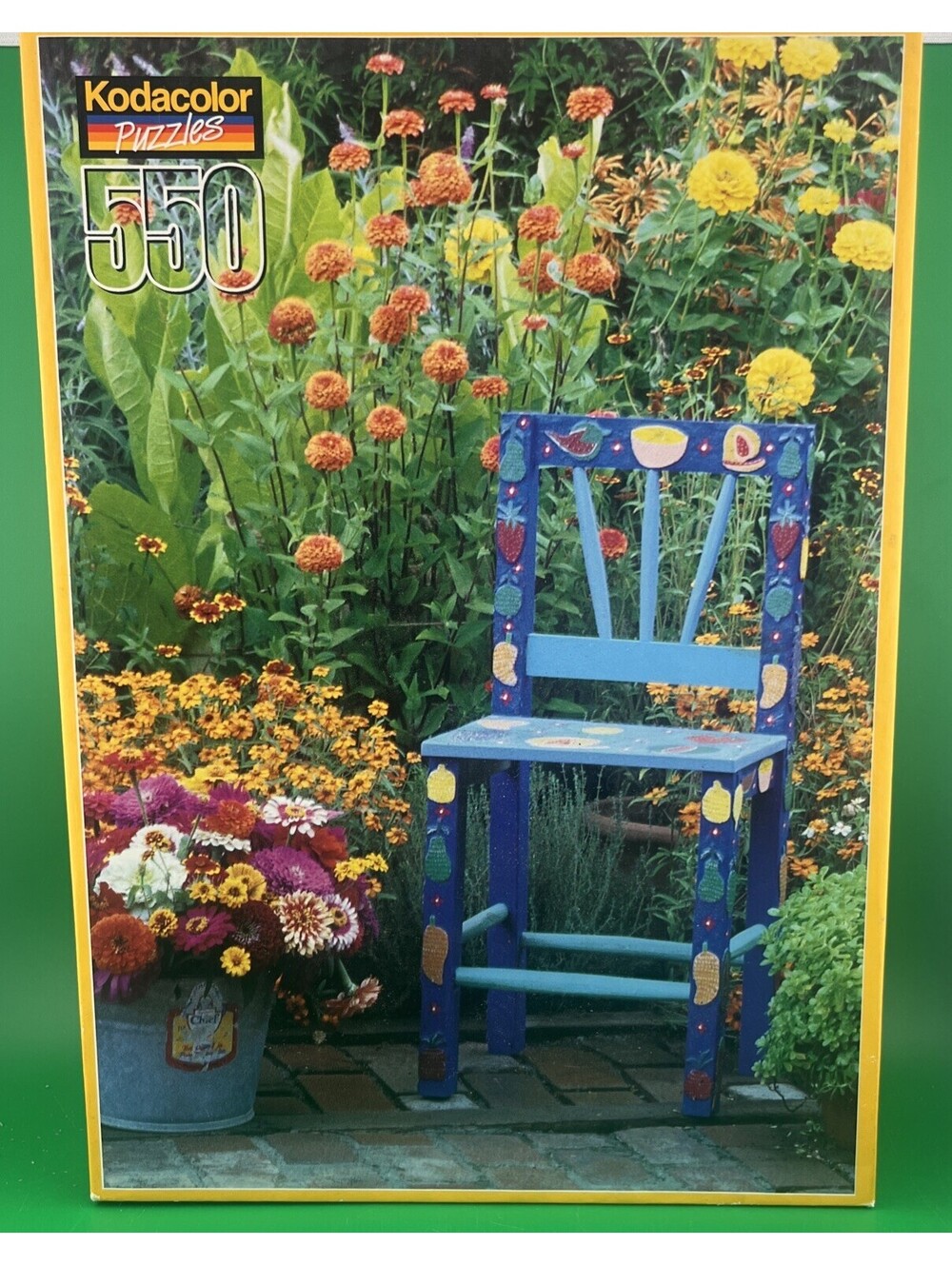 Kodak 550 Piece Jigsaw Puzzle Blue Chair Garden Flowers Courtyard